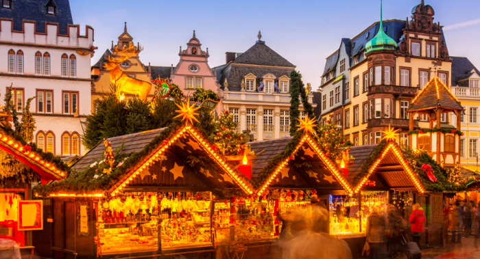 When do Europeans begin decorating for Christmas?